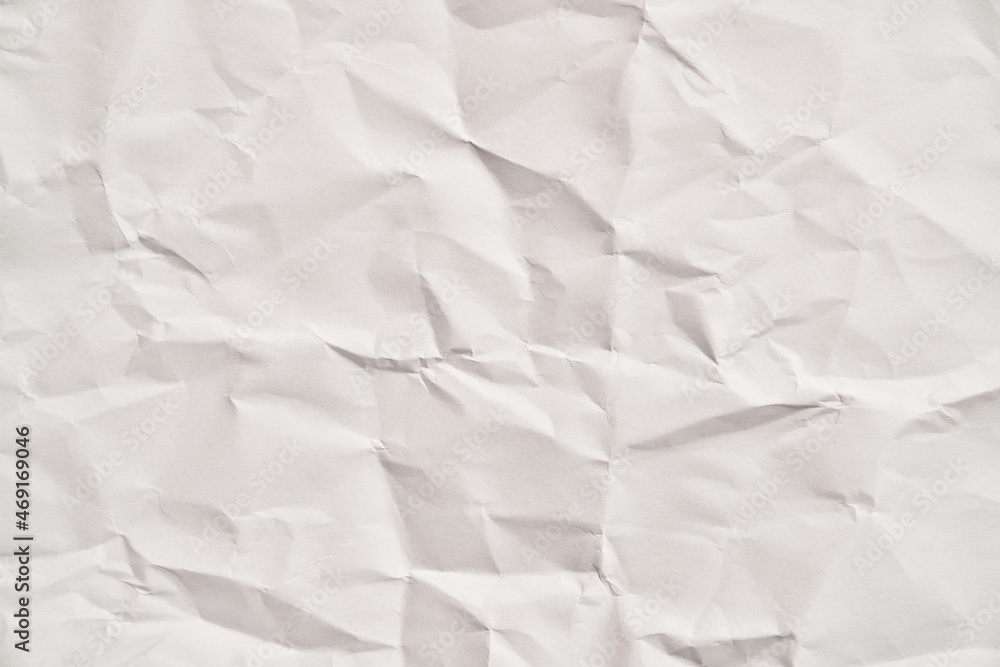 White crumpled paper texture with wrinkles. Damaged and torn sheet White crumpled paper texture with wrinkles. Damaged and torn sheet