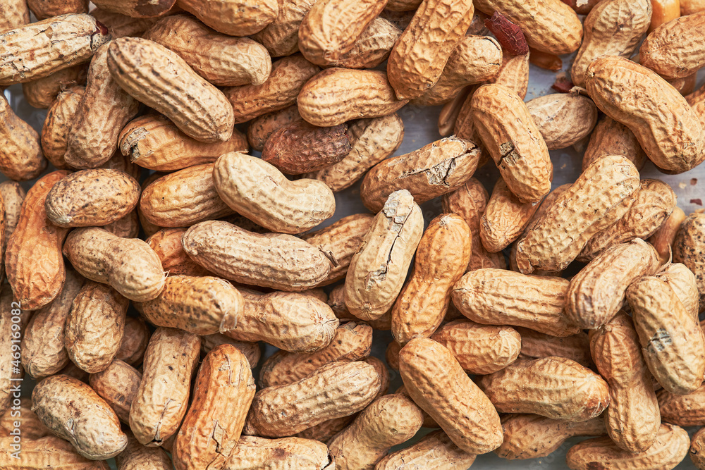 Healthy roasted unpeeled peanuts. Brown nuts texture Healthy roasted unpeeled peanuts. Brown nuts texture
