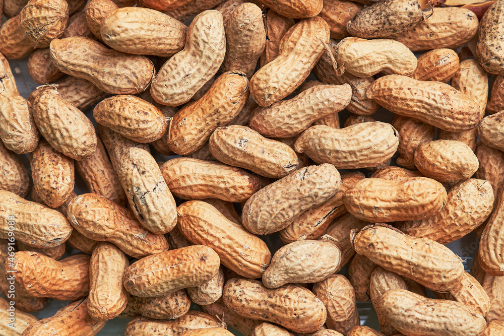 Healthy roasted unpeeled peanuts. Brown nuts texture Healthy roasted unpeeled peanuts. Brown nuts texture