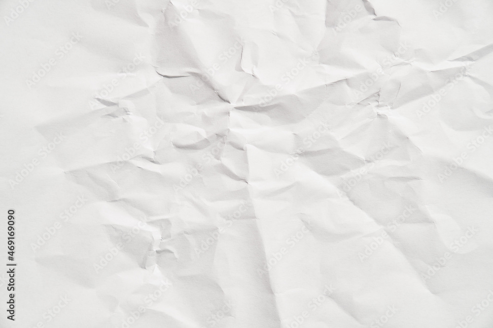 White crumpled paper texture with wrinkles. Damaged and torn sheet White crumpled paper texture with wrinkles. Damaged and torn sheet