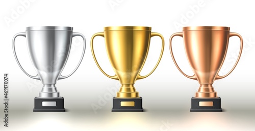 Golden silver bronze cups. Different prize places awards, realistic metal goblets, winners trophies for first second and third place, championship and victory symbol, vector isolated set