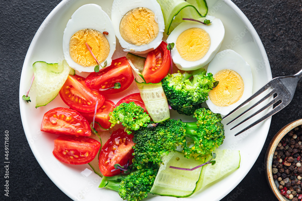 salad vegetables and egg, broccoli, tomato, cucumber, meal snack on the table copy space food background keto or paleo diet salad vegetables and egg, broccoli, tomato, cucumber, meal snack on the table copy space food background keto or paleo diet
