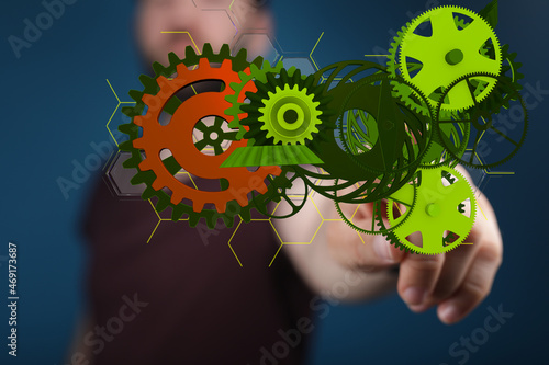 Mechanism, green metallic gears and cogs at work on brown background. Industrial machinery. 3D