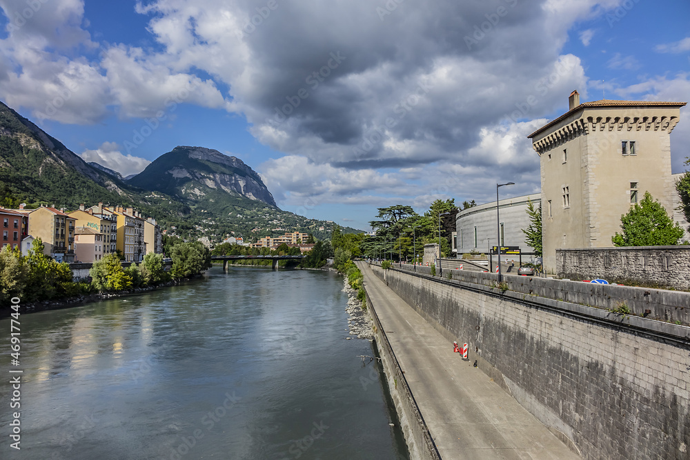 Picturesque Grenoble city view and the banks of Isere river. Grenoble, Auvergne-Rhone-Alpes region, France.