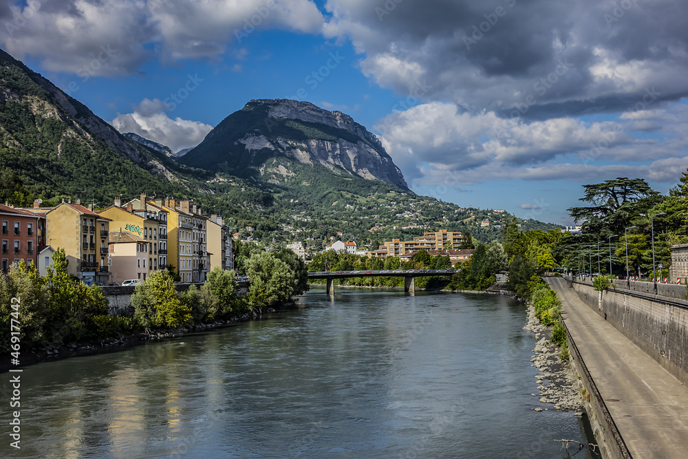 Picturesque Grenoble city view and the banks of Isere river. Grenoble, Auvergne-Rhone-Alpes region, France.