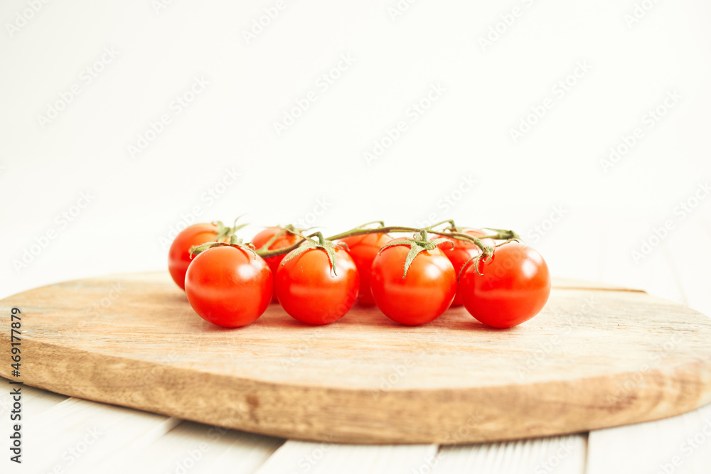 vegetables Cherry tomatoes on a cutting board wood background vegetables Cherry tomatoes on a cutting board wood background
