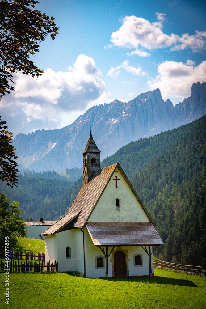 Small mountain chapel in the val d'ega Italy on a sunny day 