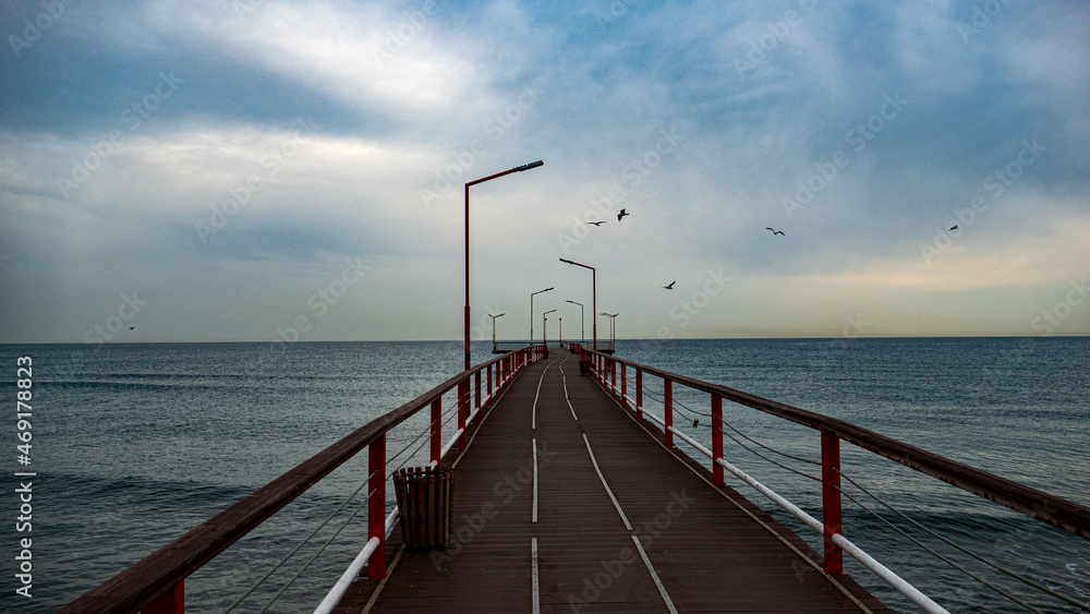 pier on the beach, bridge to the sea, wooden bridge in the sea