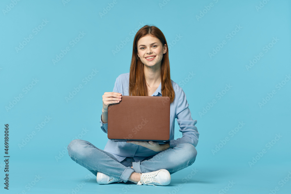 woman with laptop learning internet online education blue background woman with laptop learning internet online education blue background