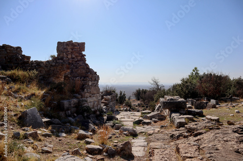 ruins of the ancient city Priene in Turkey with beautiful valley landscape on the background