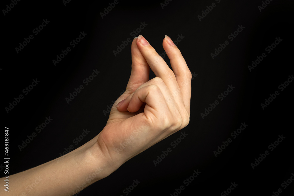 Hand gesture snapping fingers, easy sign and symbol on a black background Hand gesture snapping fingers, easy sign and symbol on a black background