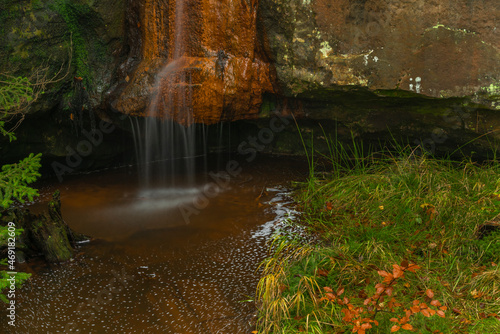 Bukovy waterfall near Jedlova station in autumn color wet morning photo