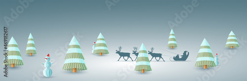 Winter christmas background with paper fir trees and snowmen in origami style and reindeer sled with Santa Claus with copy space