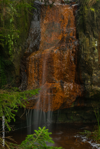 Bukovy waterfall near Jedlova station in autumn color wet morning