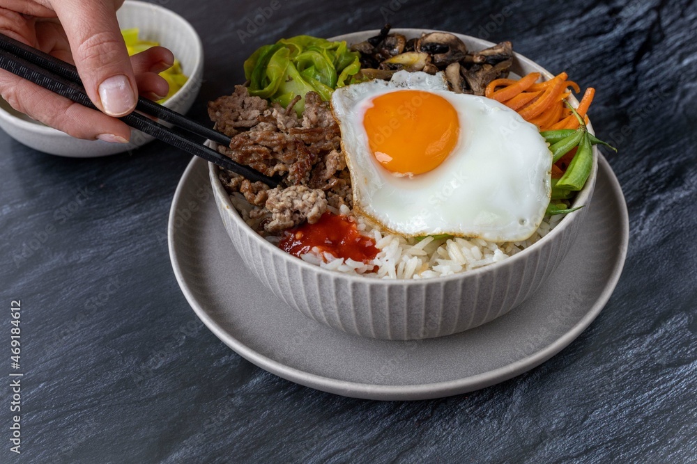 Traditional Korean dish- bibimbap: rice with vegetables and ground beef