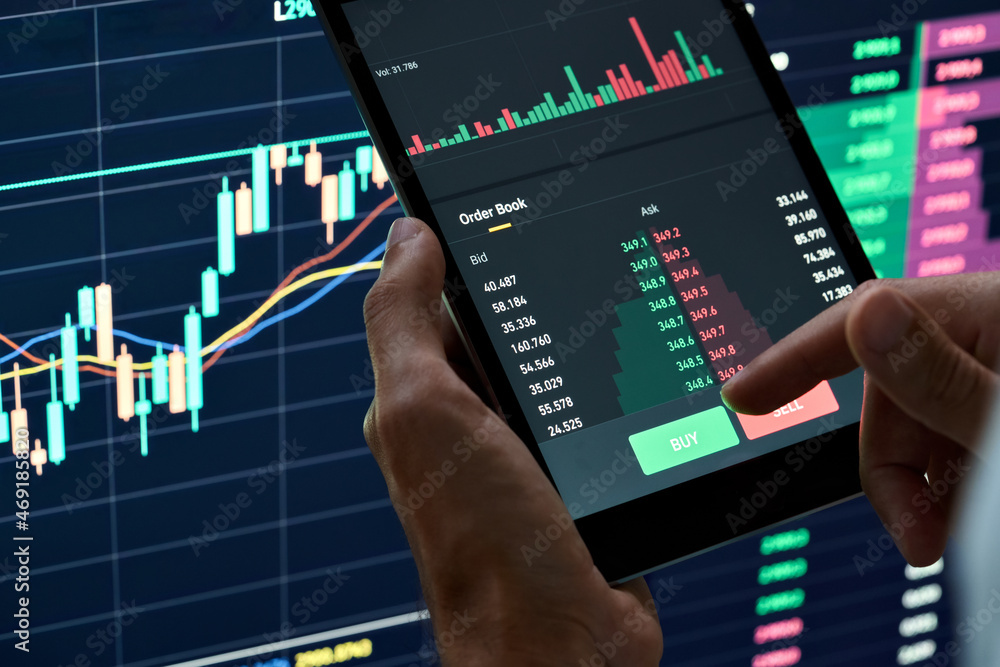 Crypto trader investor broker holding finger on buy or sell button executing financial stock trade market trading order thinking of cryptocurrency or shares assets investment risks and profit concept. Crypto trader investor broker holding finger on buy or sell button executing financial stock trade market trading order thinking of cryptocurrency or shares assets investment risks and profit concept.