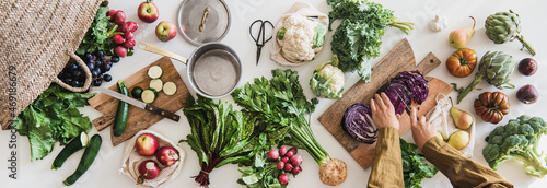 Female cutting fresh vegan ingredient for healthy cooking