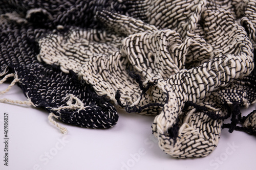 Black and White Handicraft Clothes on White Background . Close up Detail of Hand Woven Cotton Scarf , Design texture and Pattern by Artisans in Northern Villages of Thailand © foreverhappy
