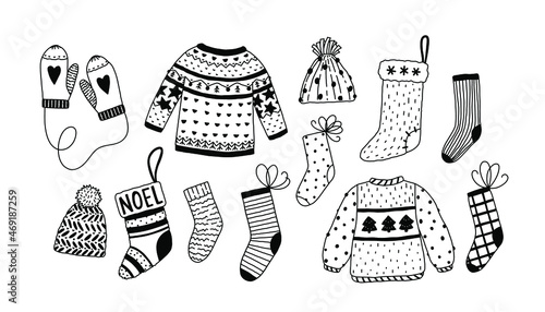 Vector warm clothes set. Doodle clothes elements - socks, Christmas stocking, mittens, sweaters, hats.