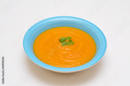 pumpkin puree soup close-up on a white background