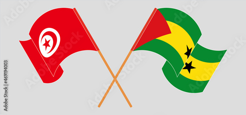 Crossed and waving flags of Tunisia and Sao Tome and Principe