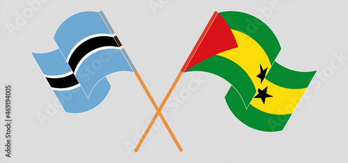 Crossed and waving flags of Botswana and Sao Tome and Principe