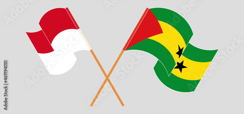 Crossed and waving flags of Monaco and Sao Tome and Principe