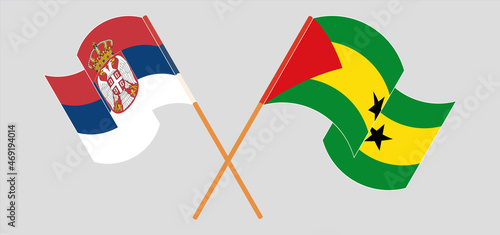 Crossed and waving flags of Serbia and Sao Tome and Principe