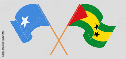 Crossed and waving flags of Somalia and Sao Tome and Principe