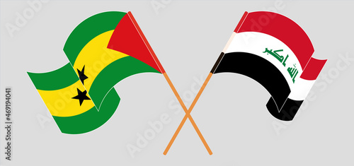 Crossed and waving flags of Iraq and Sao Tome and Principe