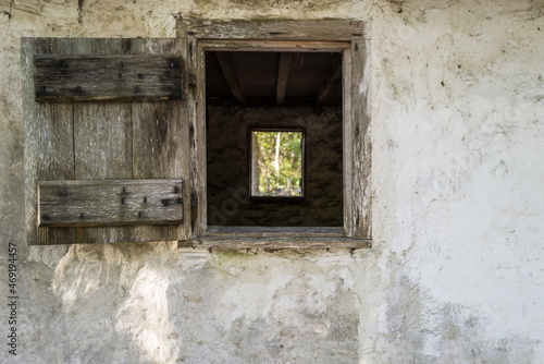 Old weathered and worn wall with windows