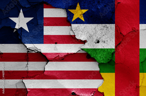 flags of Liberia and Central African Republic painted on cracked wall