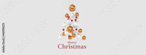 merry christmas écrit sur fond gris clair avec boules de Noël qui forment un sapin photo