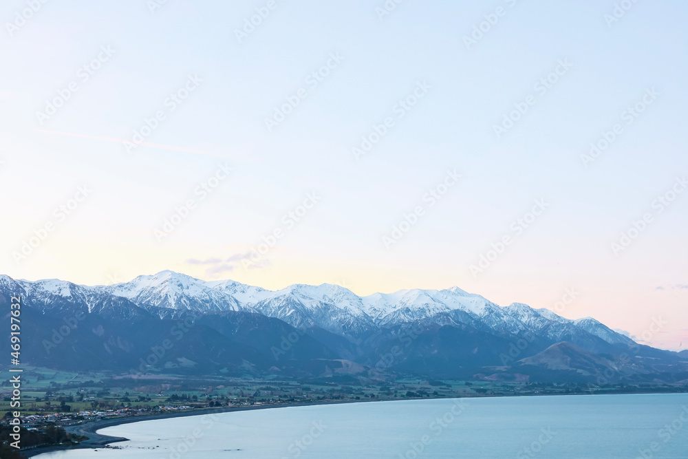 Snow covered mountains by the Ocean Snow covered mountains by the Ocean