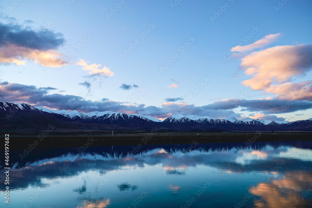 lake and snowy mountain reflection