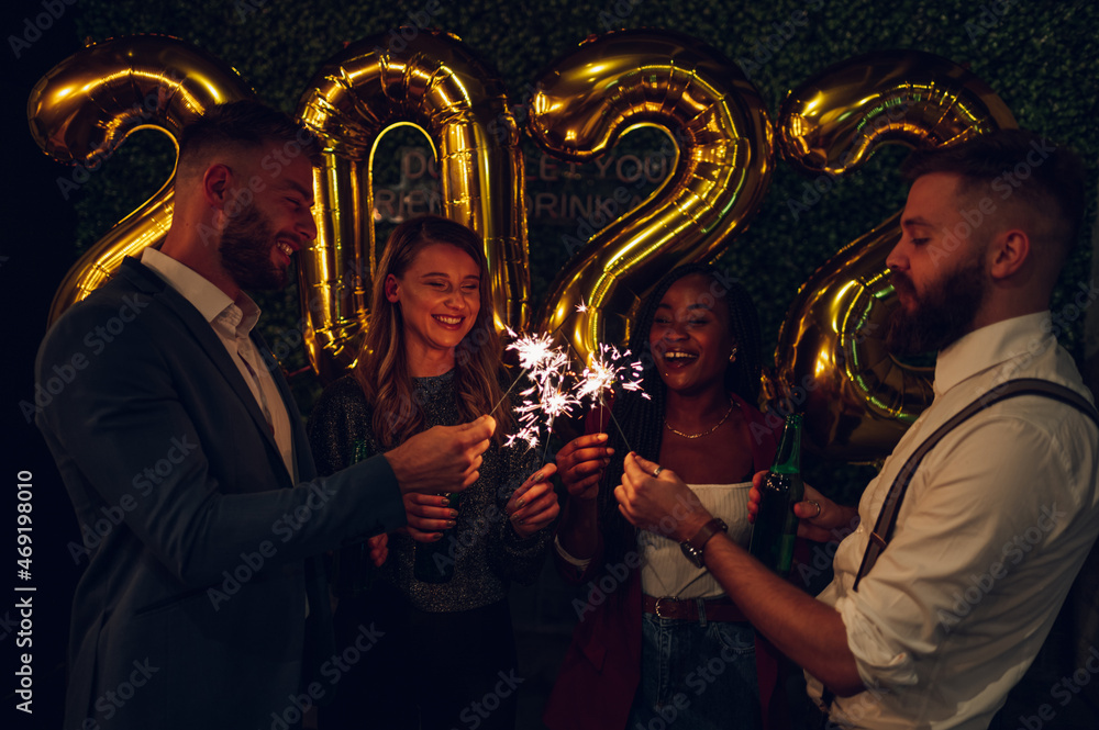 Happy group of friends celebrate New Year's Eve in a club Happy group of friends celebrate New Year's Eve in a club