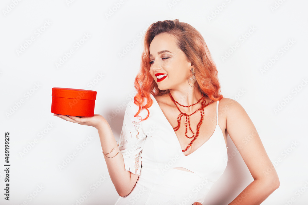 New year christmas girl holding her gift in a red box New year christmas girl holding her gift in a red box