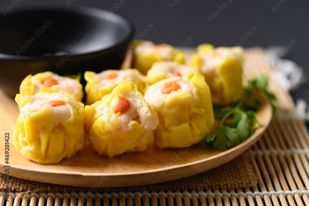 Shrimp shumai, Open-topped dumpling filled with chopped shrimp, Traditional Chinese steamed dumpling Shrimp shumai, Open-topped dumpling filled with chopped shrimp, Traditional Chinese steamed dumpling