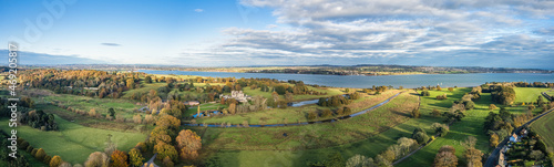 Panorama over Powderham Castle and Park from a drone in Autumn Colors, Exeter, Devon, England, Europe
