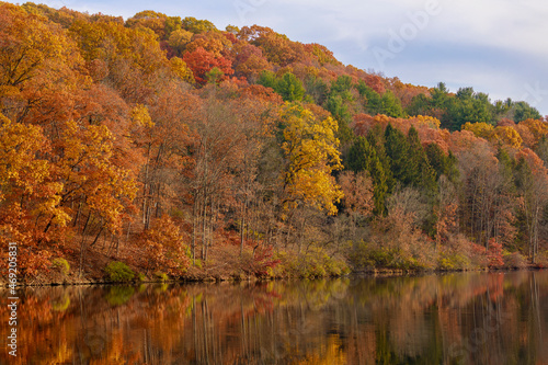 Trees with Autumn colors on the shore of Raccoon Lake and Raccoon Creek State Park.