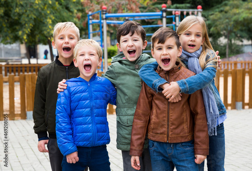 Joyful children on street of autumn city. High quality photo © JackF