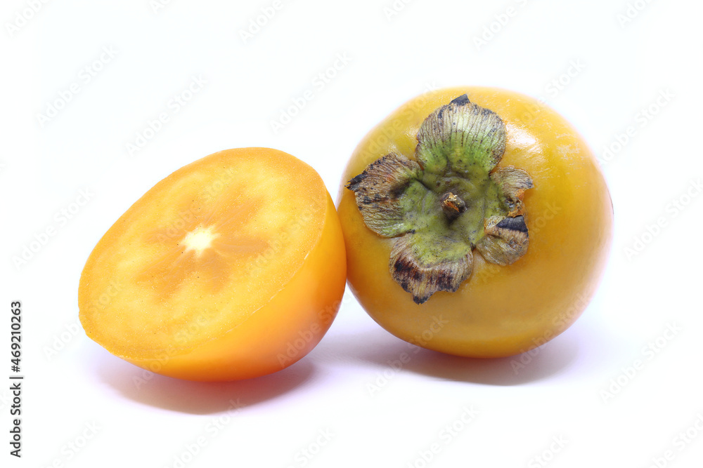 Fresh persimmon fruit on white background