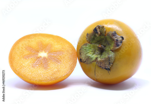 Fresh persimmon fruit on white background photo