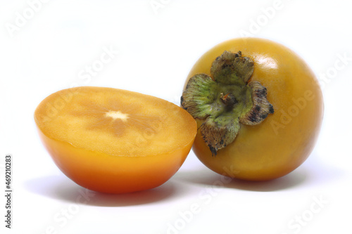 Fresh persimmon fruit on white background photo