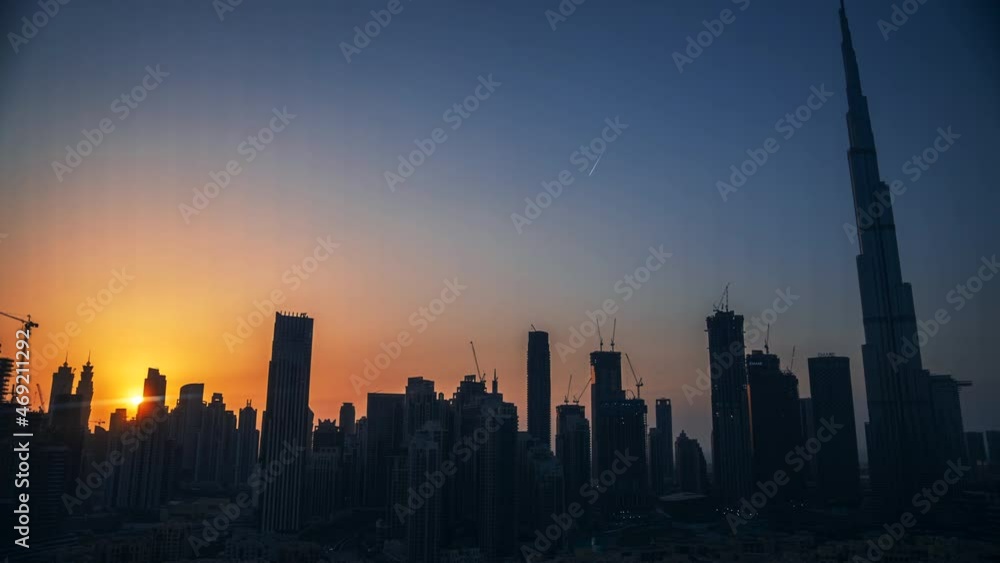 Sunset to night Time lapse of Dubai Skyline, colorful sky and Illuminated cityscape Sunset to night Time lapse of Dubai Skyline, colorful sky and Illuminated cityscape