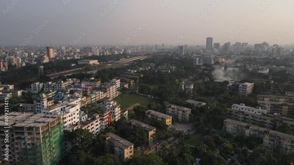 Drone view of green spaces amongst buildings of densely populated Dhaka; air pollution Drone view of green spaces amongst buildings of densely populated Dhaka; air pollution