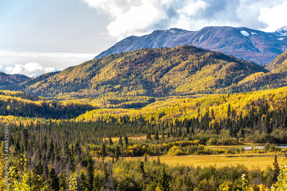 The remarkable, stunning, autumn, fall landscape of Yukon Territory in Northern Canada. Highway, road trip shot with mountain views. 