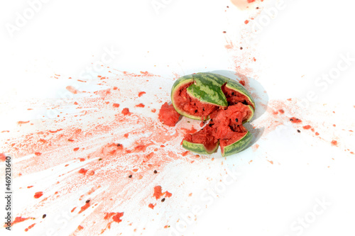 Broken crashed smashed watermelon on white background
