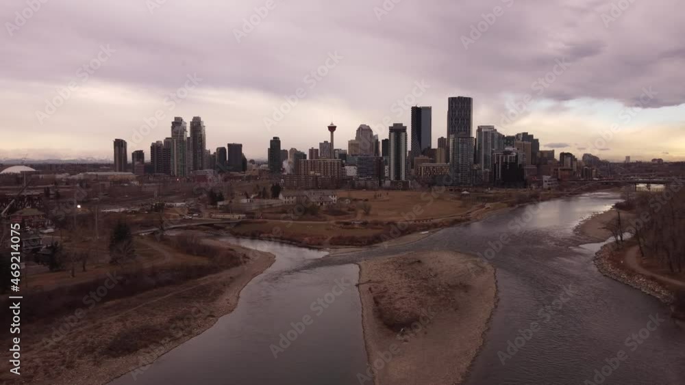 Calgary Alberta Canada, November 12 2021: Aerial view of a Canadian City downtown district over the Bow River. Calgary Alberta Canada, November 12 2021: Aerial view of a Canadian City downtown district over the Bow River.