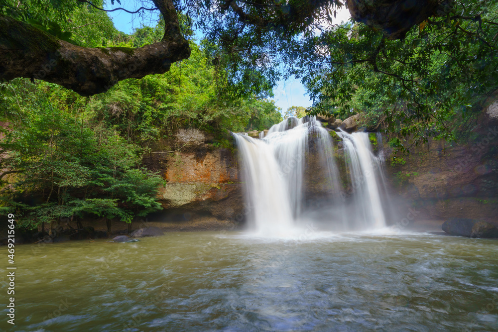 Fototapeta premium Beautiful waterfall with sunlight in jungle, Haew Suwat Waterfall at khao yai Nakhonratchasima province